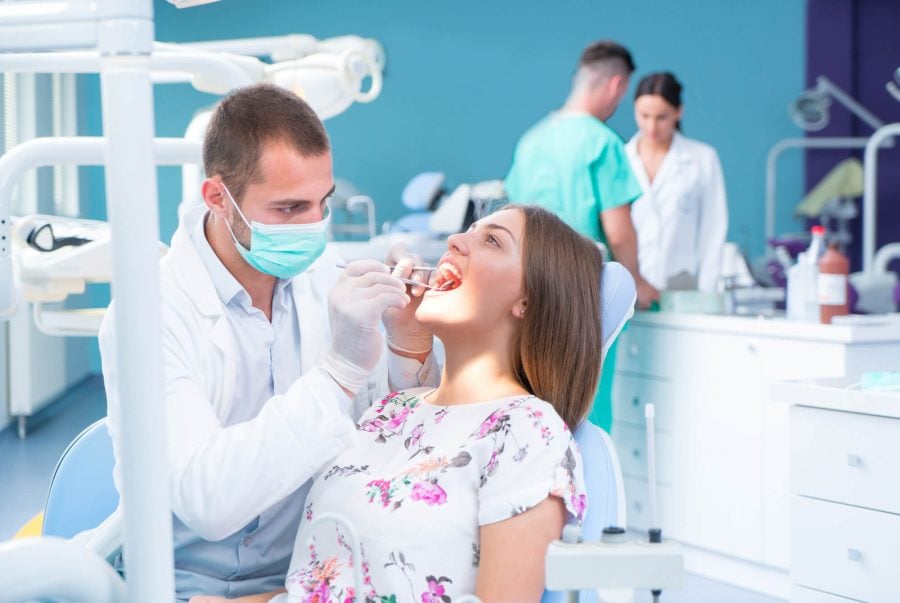 Dentist in 33062 performing oral surgery